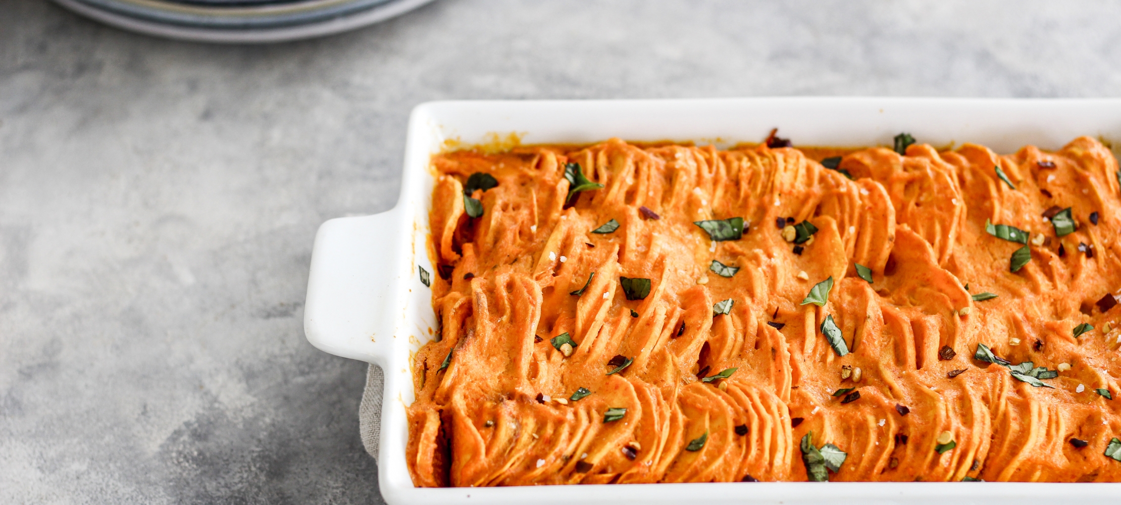 Hasselback Sweet Potatoes with a Red Pepper Sauce –