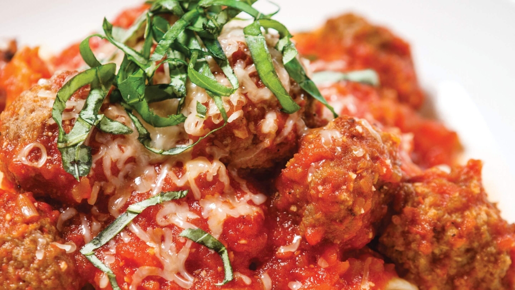 Up close view of a bowl of Easy Turkey Pesto Meatballs with Penne