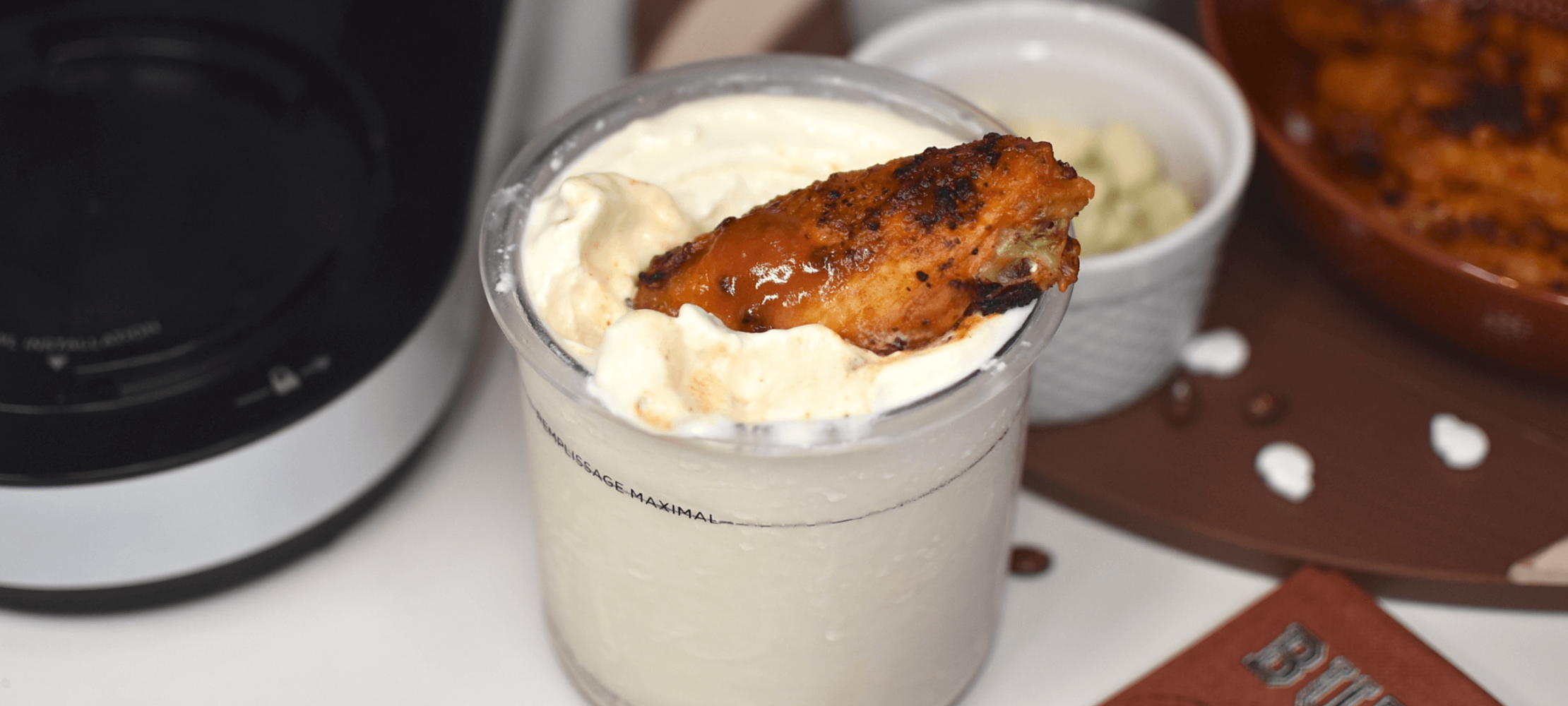 Cup of cursed ice cream with a piece of chicken in it